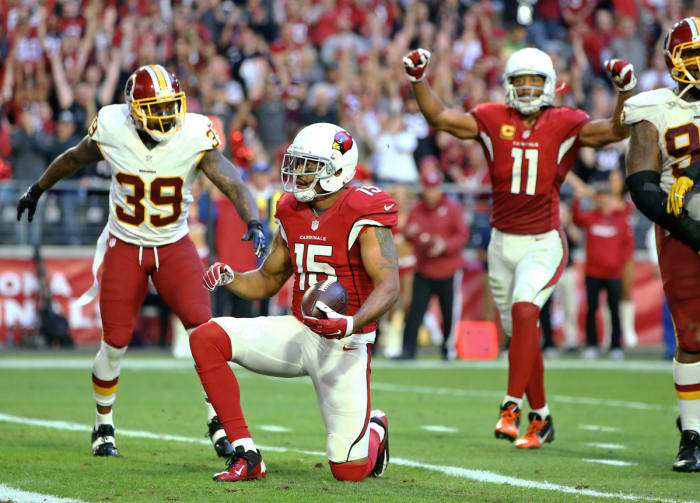 Arizona receivers Michael Floyd (15) and Larry Fitzgerald (11) celebrate after Floyd scored against Washington in 2016. Both are among the 13 players in Cardinals history to catch more than 1,000 receiving yards in a season.